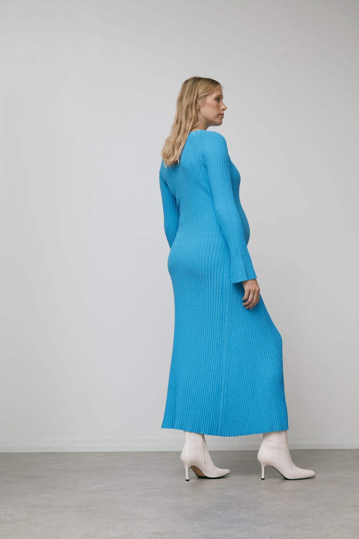 The Ava blue knitted breastfeeding-friendly maternity dress, back view
